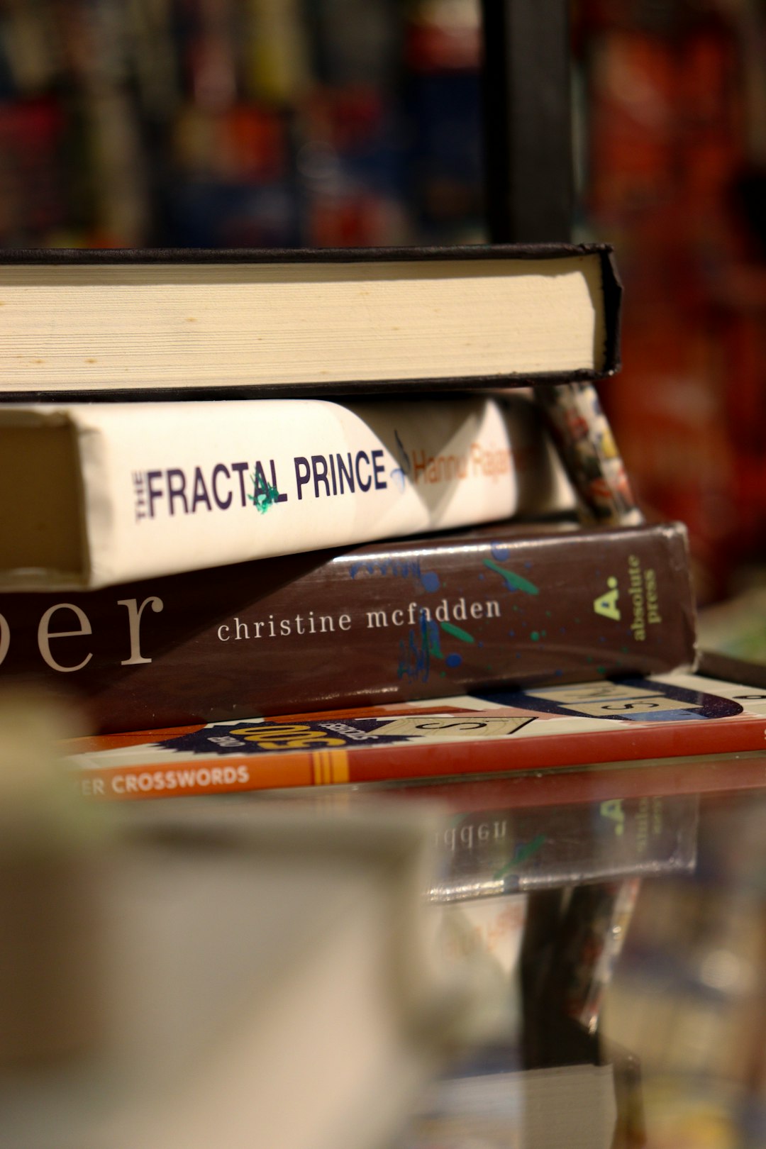 a-stack-of-books-sitting-on-top-of-a-table-wnufljmpyeq